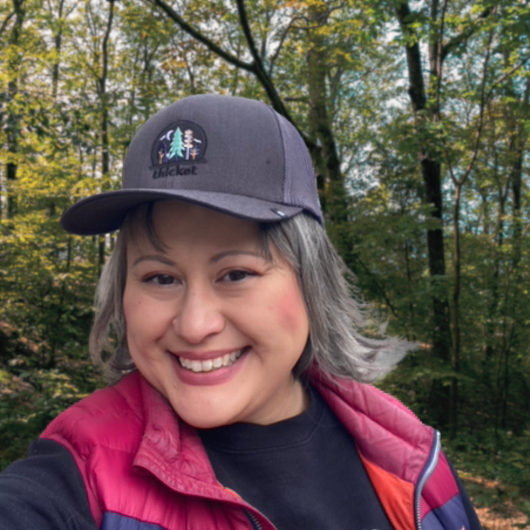 beautiful happy friend wearing the thicket adventure hat.