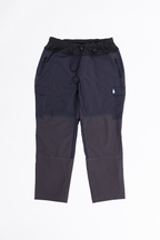 A pair of gray plus-size hiking pants with an outer cord waistband. 