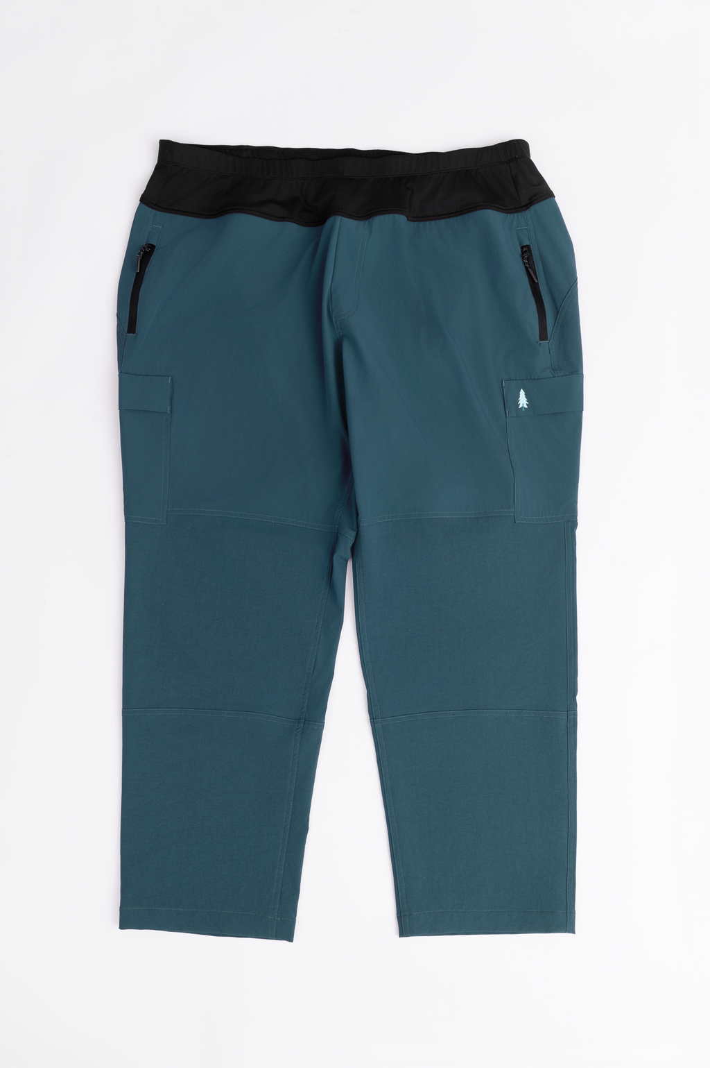 Teal pants with black waistband on a white background
