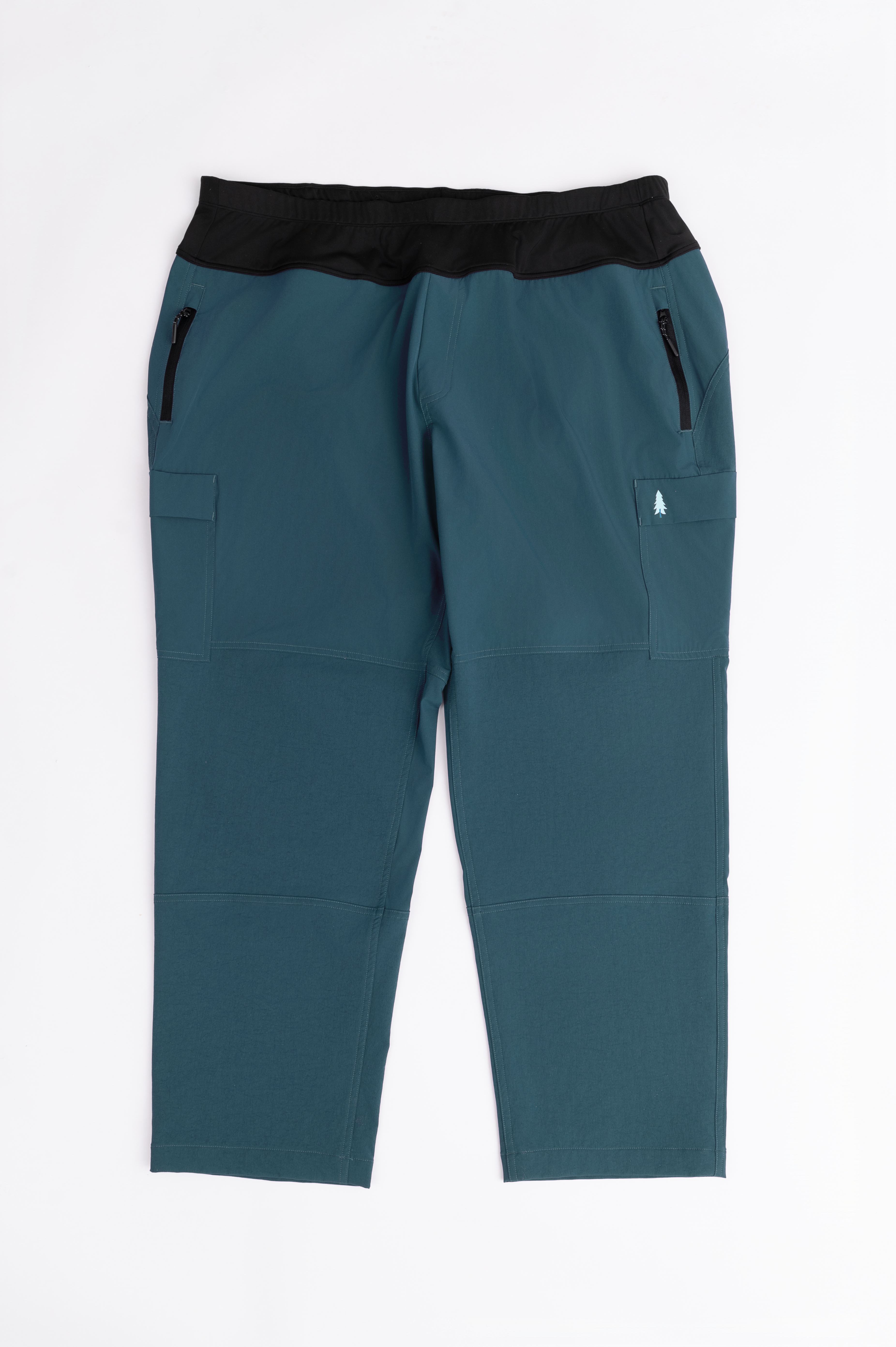 Teal pants with black waistband on a white background