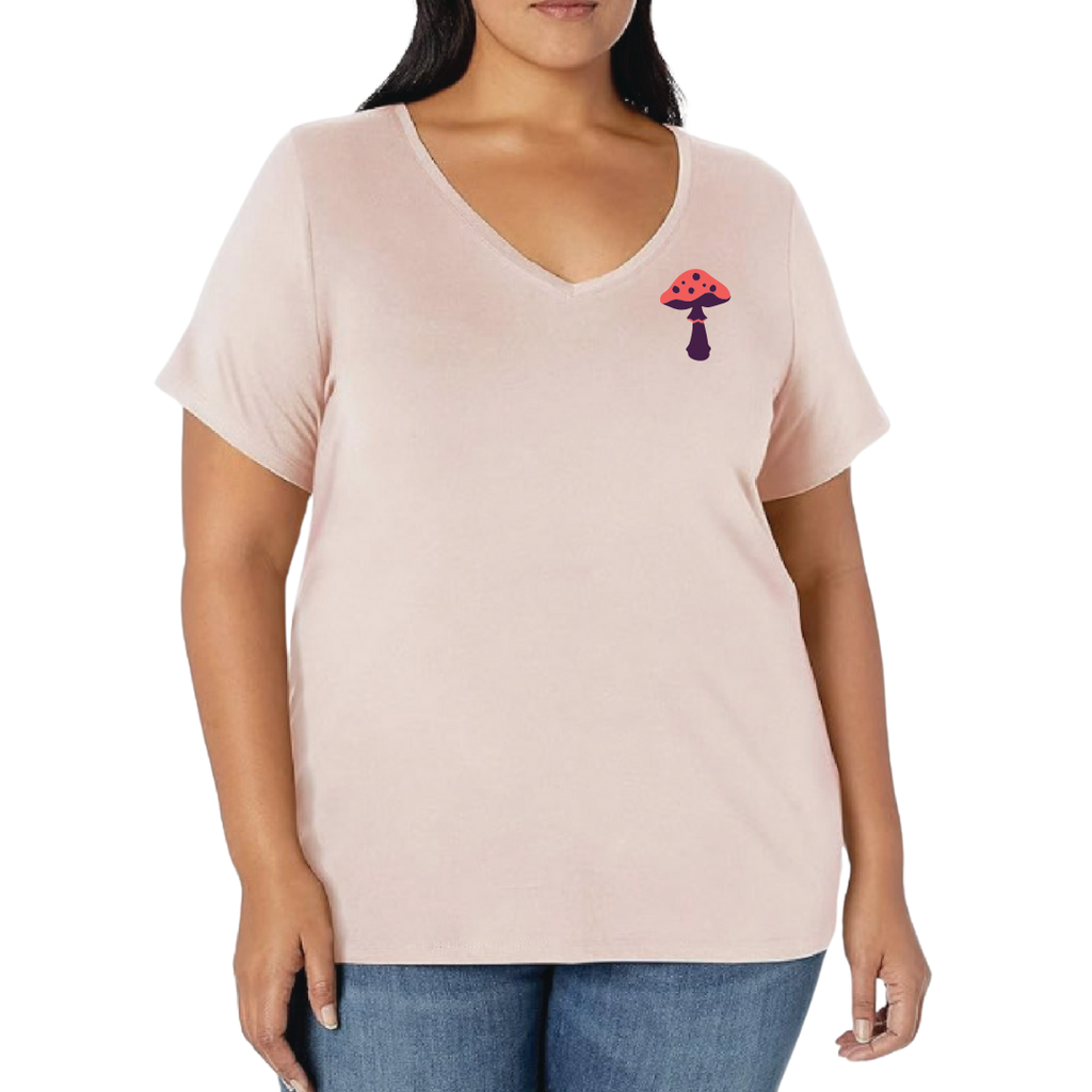 Woman wearing a light pink t-shirt with a small graphic on a white background